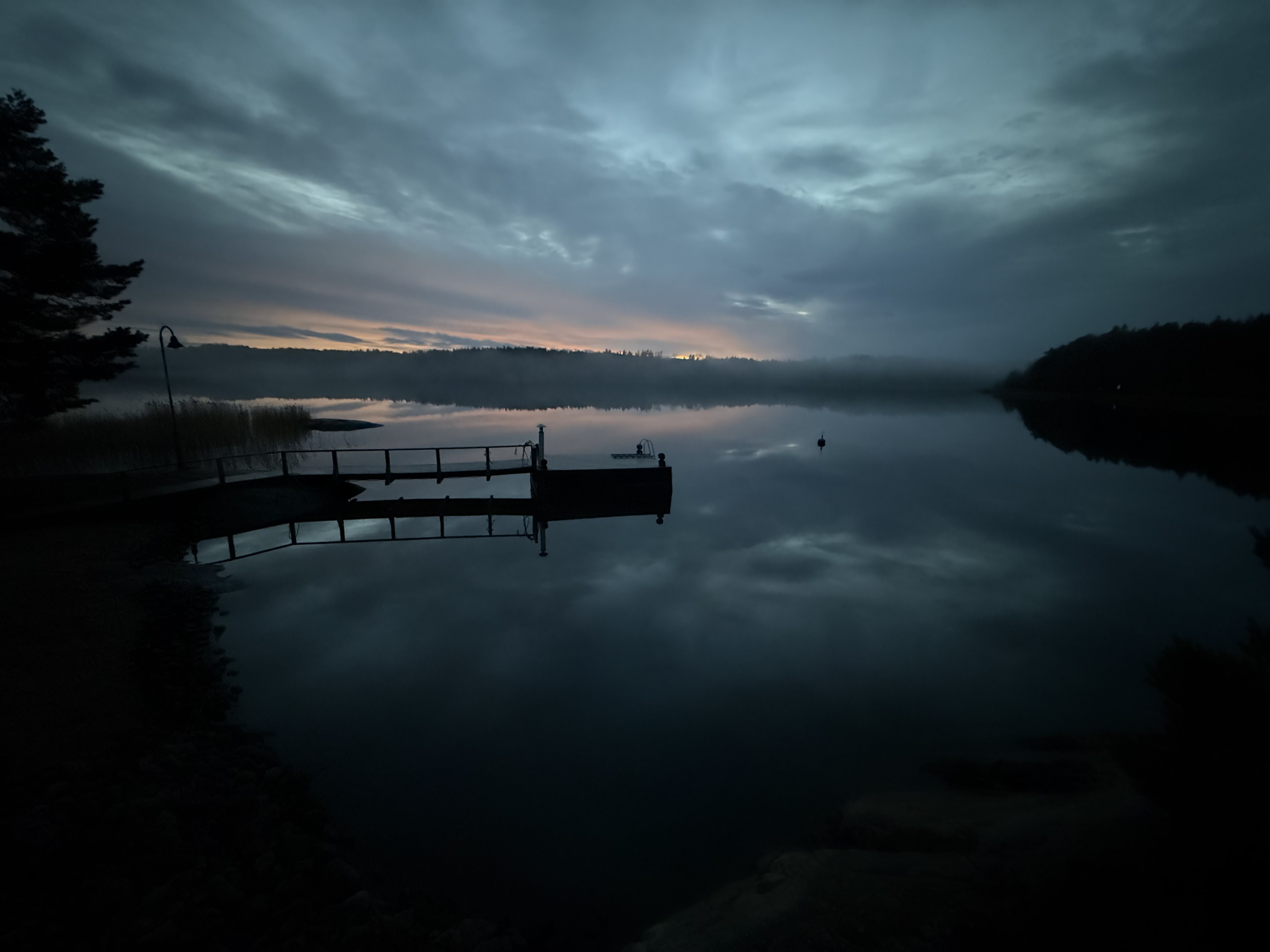 Twilight over a still Nordic lake